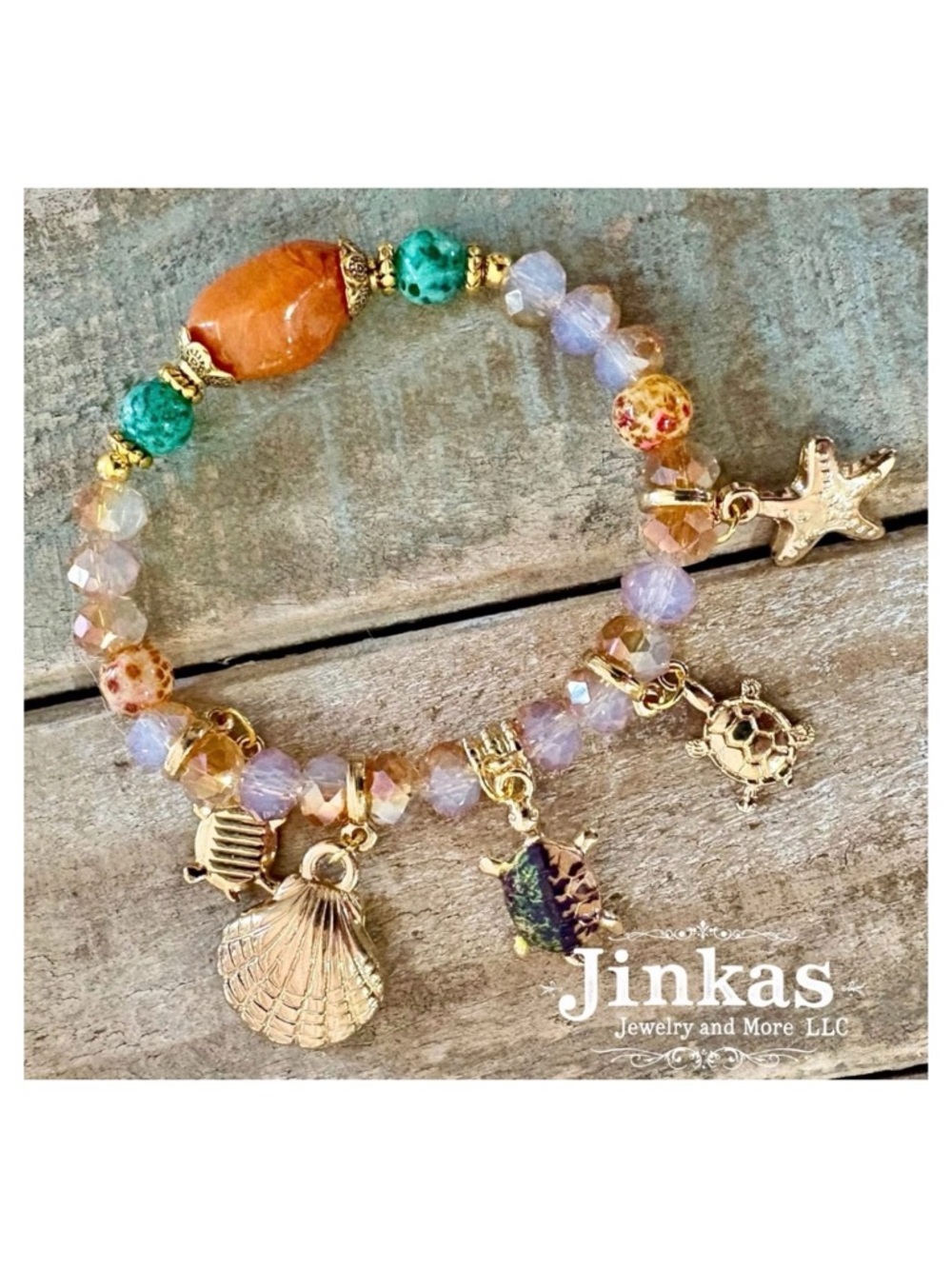 Hand Crafted stretch charm bracelet -starfish, turtles, and shell.